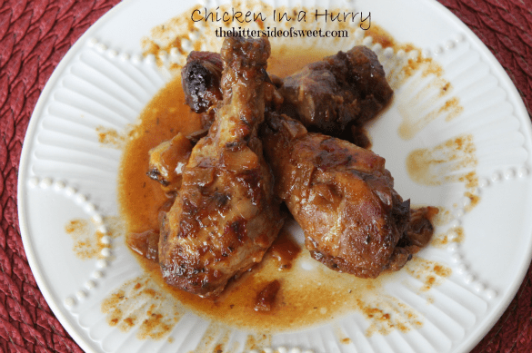 Chicken in a Hurry is a slow cooker chicken that has a great tangy base cooked till the meat falls off the bones! Prep time is minimal and the slow cooker does the rest! Chicken In a Hurry on a white plate