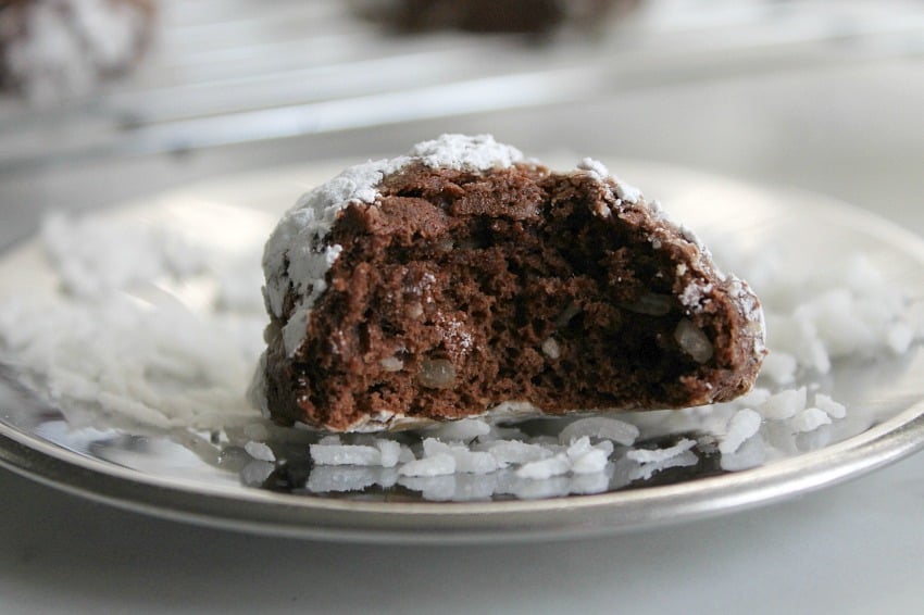 These Coconut Crinkle Cookies are a classic crinkle cookie recipe with the added flavor of coconut! Perfect for holiday baking! | The Bitter Side of Sweet #coconut #chocolate #cookies Coconut Crinkle Cookies - The Bitter Side of Sweet