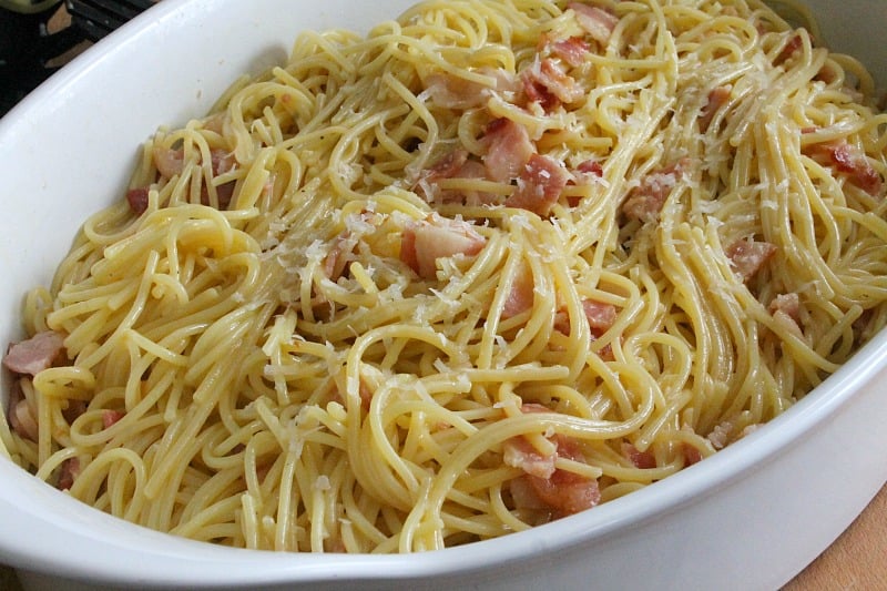 Bacon is the star of this Spaghetti alla Carbonara Recipe! A traditional Italian dish that is made simple and ready in 30 minutes! Spaghetti alla Carbonara in a white bowl