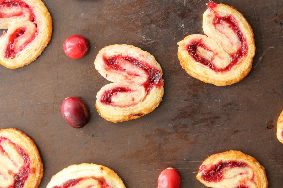 Cranberry Palmiers are an elegant cookie made with puff pastry and a cranberry sauce. It will make a nice additional to your dessert table! | The Bitter Side of Sweet Cranberry Palmiers