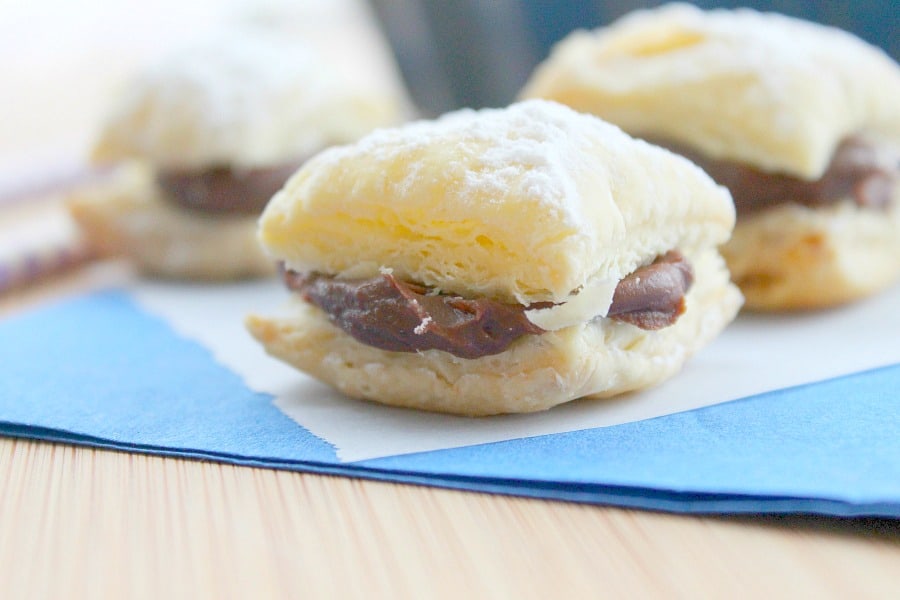 Four ingredient puff pastry dessert that brings alive these Miguelitos with Chocolate dessert! Perfect for Cinco de Mayo or any day of the week! Miguelitos with Chocolate on blue napkin