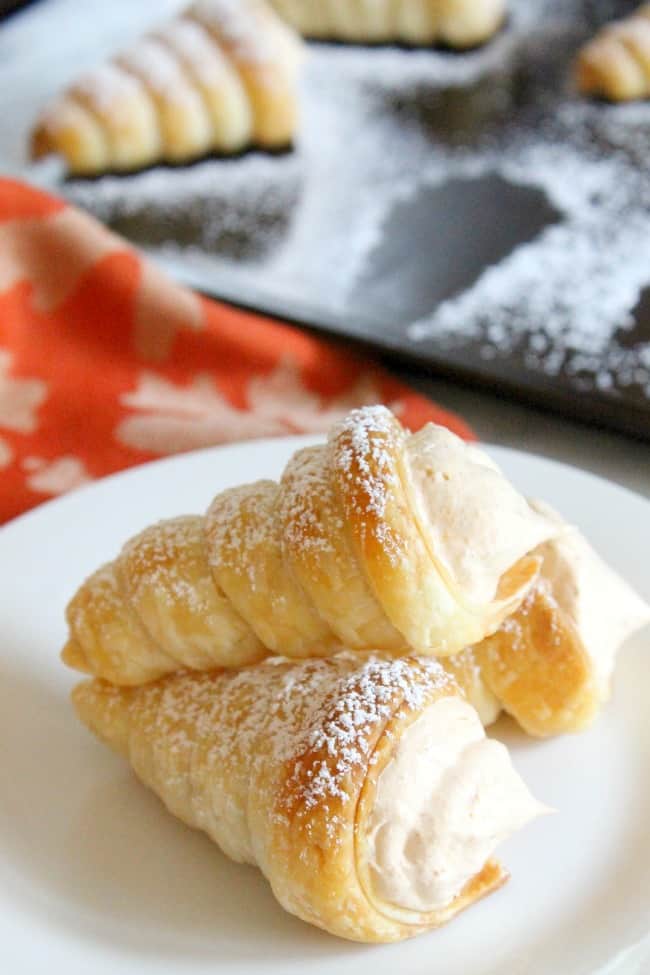 Pumpkin Cream Horns are a simple dessert that’s perfect for the season! You’ll love the light and fluffy filling full of delicious spices! Pumpkin Cream Horns | The Bitter Side of Sweet #pumpkin