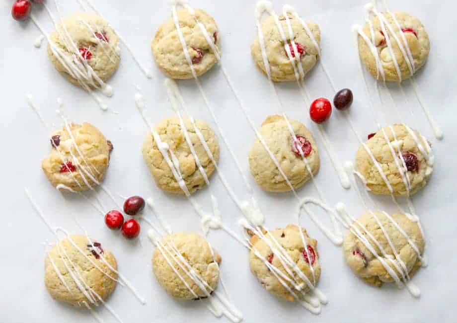These Cranberry White Chocolate Chip Cookies will get you in the mood for baking! Loaded with lots of flavor, you won't want to pass them up! Cranberry White Chocolate Chip Cookies drizzled with white chocolate.