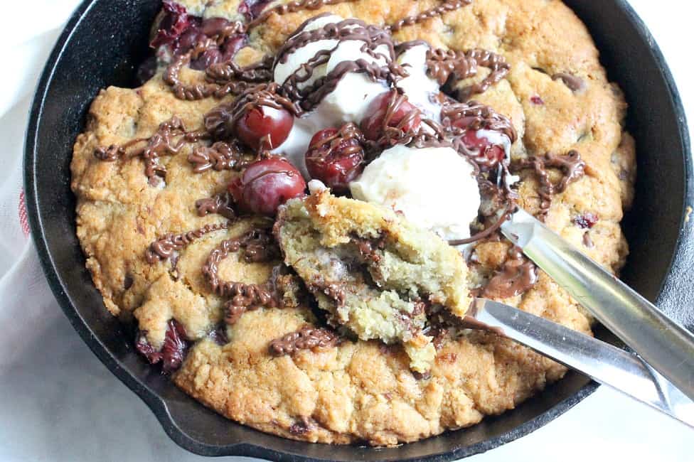 Warm chocolate chip cookie and cherries makes this delicious gooey Chocolate Cherry Skillet Cookie the perfect dessert for two! | The Bitter Side of Sweet #cookie #cherry #chocolate #dessert Chocolate Cherry Skillet Cookie in skillet