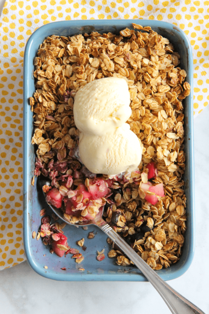 This Apple Blueberry Crisp is made with just a few ingredients of fresh fruit, honey and oats! You will love this lightened up dessert! Apple Blueberry Crisp in blue dish