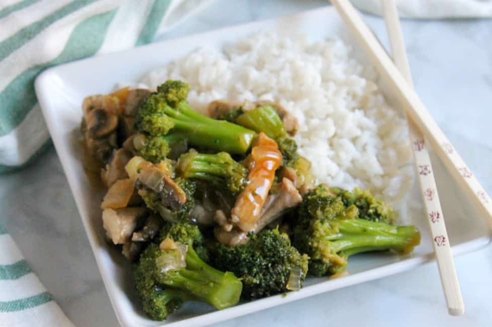 Broccoli Pork Stir Fry is a super quick meal to make! You can add it over rice and have dinner ready in less than 30 minutes! Broccoli Pork Stir Fry on white plate