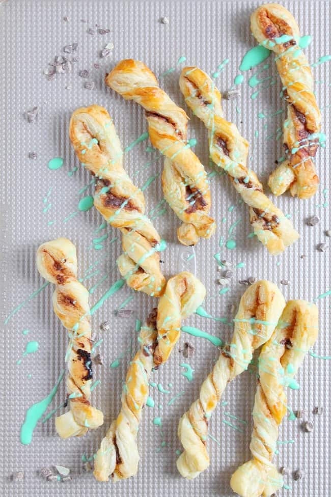 Mint Chocolate Cinnamon Sticks are an easy sweet treat. The chocolate mint combo in buttery puff pastry is the perfect combination! Mint Chocolate Cinnamon Sticks on white plate