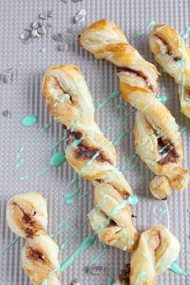 Mint Chocolate Cinnamon Sticks are an easy sweet treat. The chocolate mint combo in buttery puff pastry is the perfect combination! Mint Chocolate Cinnamon Sticks on white plate