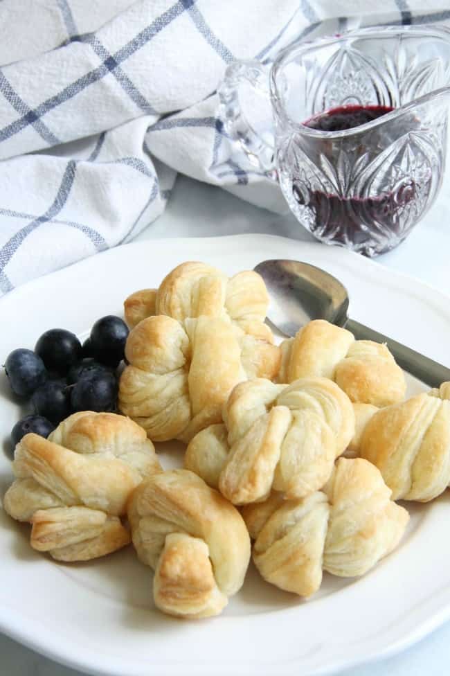 Easy Puff Pastry Blueberry Knots can actually be made with any summer berry. You’ll love how quickly these come together – just in time for brunch! Easy Puff Pastry Blueberry Knots