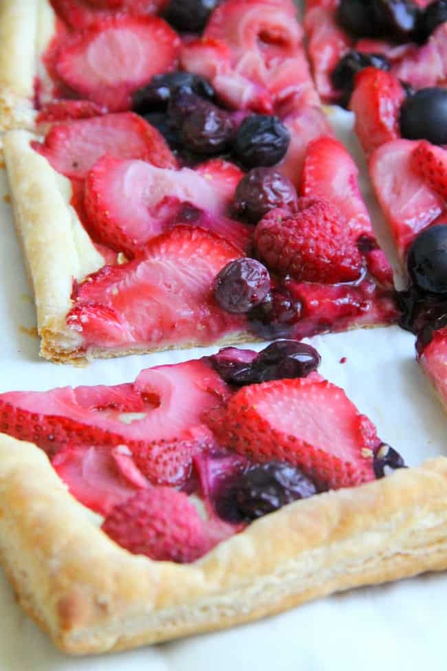 This easy Mixed Berry Tart makes for one spectacular summer dessert. It couldn’t be easier and easily adapted to any berry you wanted to use! Mixed Berry Tart on white background