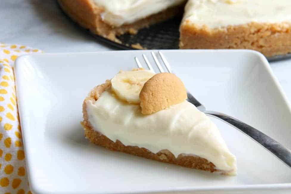 Banana Pudding No Bake Cheesecake has the flavors of a classic and the form of a cheesecake that you will love this dessert mash up! | The Bitter Side of Sweet #bananas #cheesecake #nobake Banana Pudding No Bake Cheesecake on white plate