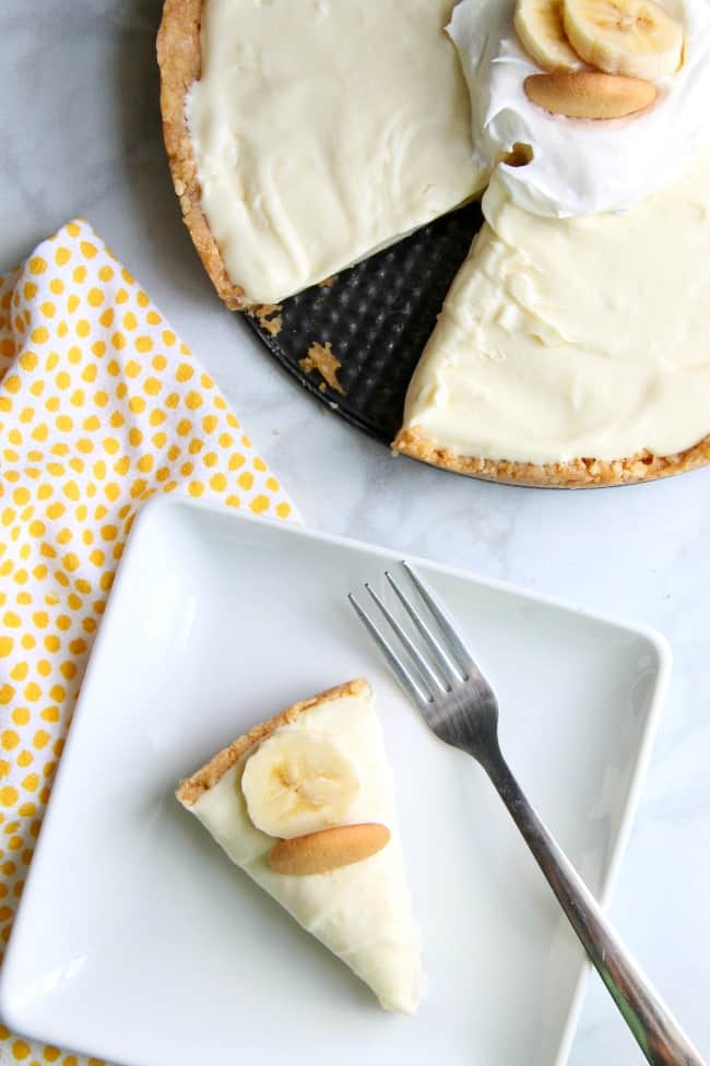 Banana Pudding No Bake Cheesecake has the flavors of a classic and the form of a cheesecake that you will love this dessert mash up! | The Bitter Side of Sweet #bananas #cheesecake #nobake Banana Pudding No Bake Cheesecake on white plate