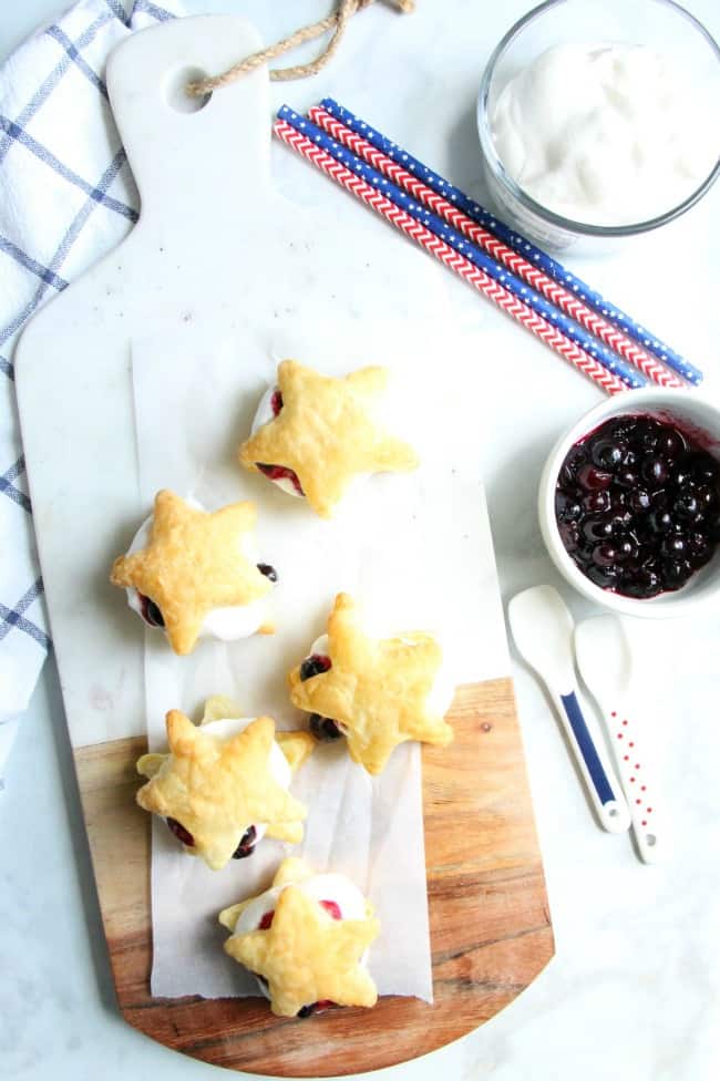 Blueberry Cream Puffs are an easy dessert for any summer barbecue you throw. Summer might be almost over, but these sweet treats are good all year long. | The Bitter Side of Sweet #blueberries #puffpastry Blueberry Cream Puffs
