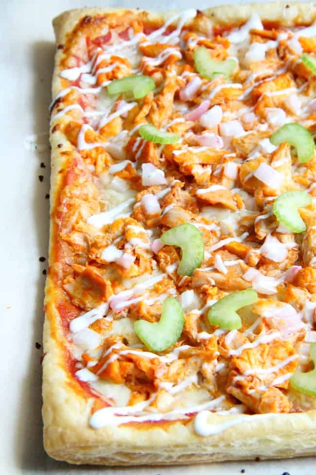 Buffalo Chicken Puff Pastry Pizza is the epitome of easy dinner. Grab a rotisserie chicken on your way home from work, you're gonna need it! | The Bitter Side of Sweet #puffpastry #chicken #buffalosauce #pizza Buffalo Chicken Puff Pastry Pizza