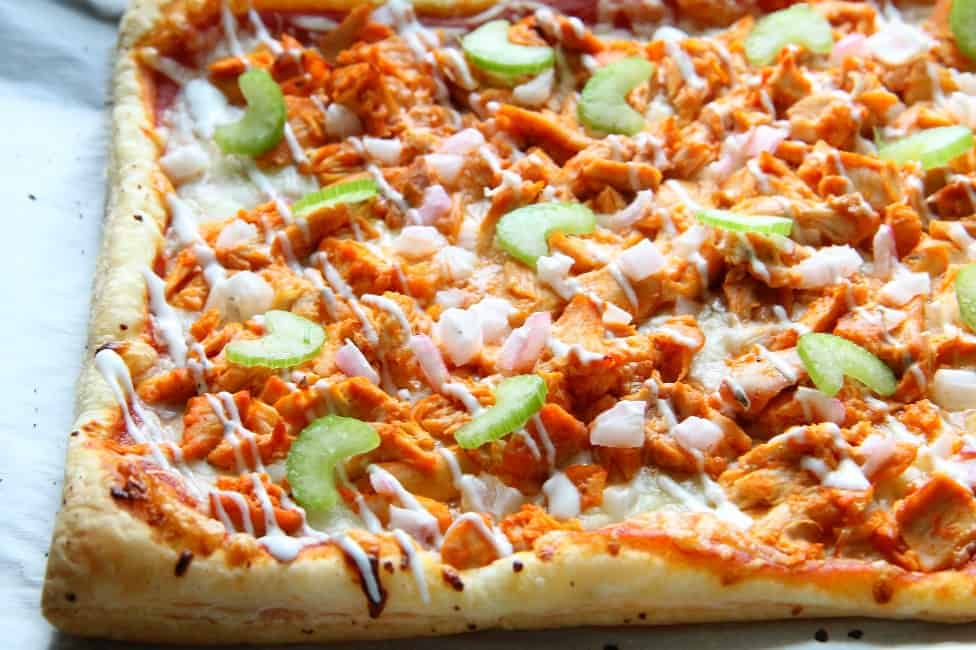 Buffalo Chicken Puff Pastry Pizza is the epitome of easy dinner. Grab a rotisserie chicken on your way home from work, you're gonna need it! | The Bitter Side of Sweet #puffpastry #chicken #buffalosauce #pizza Buffalo Chicken Puff Pastry Pizza