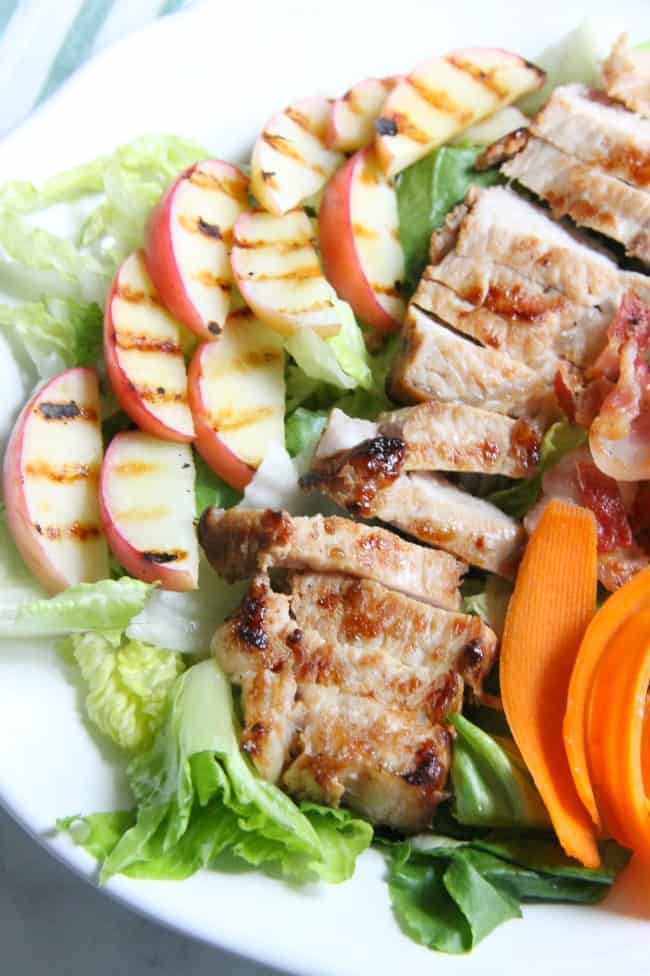 This Grilled Pork Loin Salad with Grilled Apples is a refreshing salad loaded with flavor! Top with bacon, carrots and feta cheese and you have perfection! | The Bitter Side of Sweet #ad #RealFlavorRealFast #SmithfieldRealFresh Grilled Pork Loin Salad with Grilled Apples
