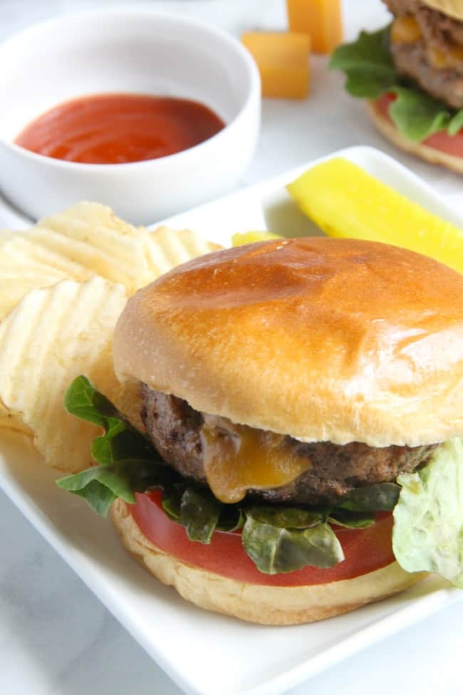 This Spicy Sriracha Juicy Lucy is a classic burger with a spicy twist! Found in Minnesota this burger pairs well with a glass of Sutter Home Riesling! | The Bitter Side of Sweet #SweetonSpice #ad Spicy Sriracha Juicy Lucy