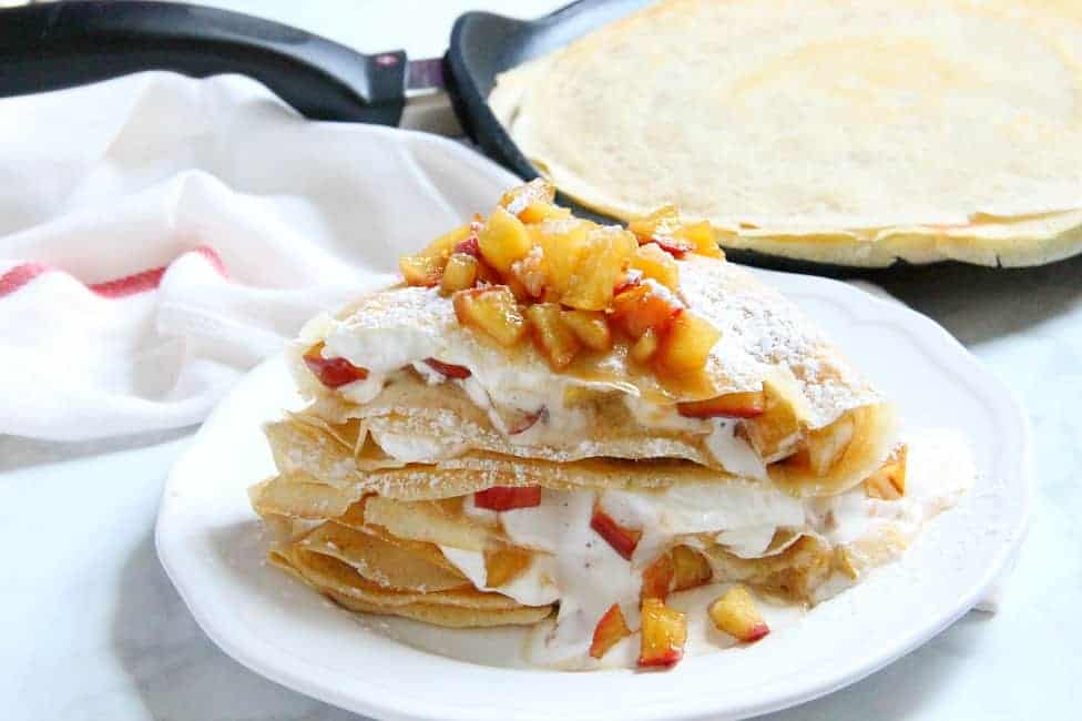 A popular French pastry these Apple Pie Crepes are elegant yet satisfying! They are filled with a warm apple compote and freshly made whipped cream! | The Bitter Side of Sweet #apples #breakfast #dessert Apple Pie Crepes