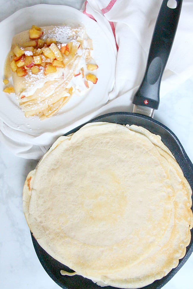 A popular French pastry these Apple Pie Crepes are elegant yet satisfying! They are filled with a warm apple compote and freshly made whipped cream! | The Bitter Side of Sweet #apples #breakfast #dessert Apple Pie Crepes