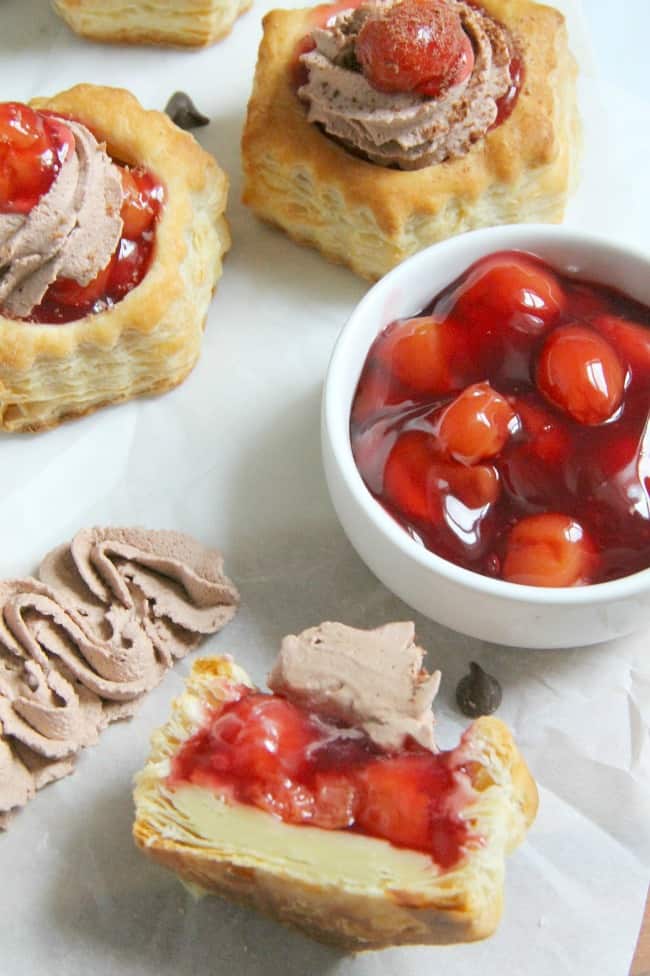 These Black Forest Pastry Cups are an elegant dessert that takes just a matter of minutes to bake up! Perfect for when you need something quick to serve! | The Bitter Side of Sweet #puffpastry #chocolate #cherries Black Forest Pastry Cups