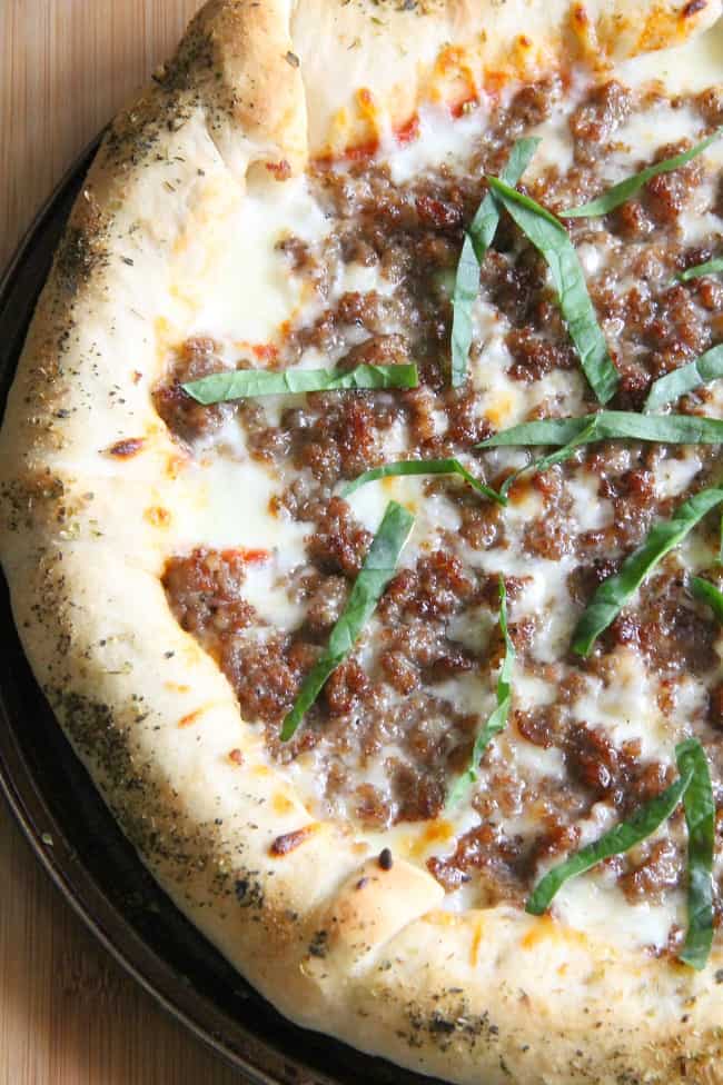 You can have the taste of store bought pizza right in your own home with this Stuffed Crust Sausage Pizza! Filled with lots of cheesy goodness! | The Bitter Side of Sweet #pizza #cheese #sausage Stuffed Crust Sausage Pizza