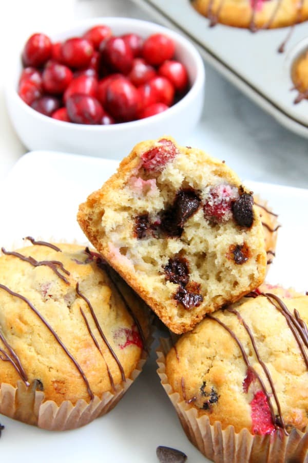 Your breakfast this winter just got an upgrade with these Cranberry Dark Chocolate Oatmeal Muffins! With the combination of cranberries and dark chocolate you'll be asking for seconds! Cranberry Dark Chocolate Oatmeal Muffins on white plate