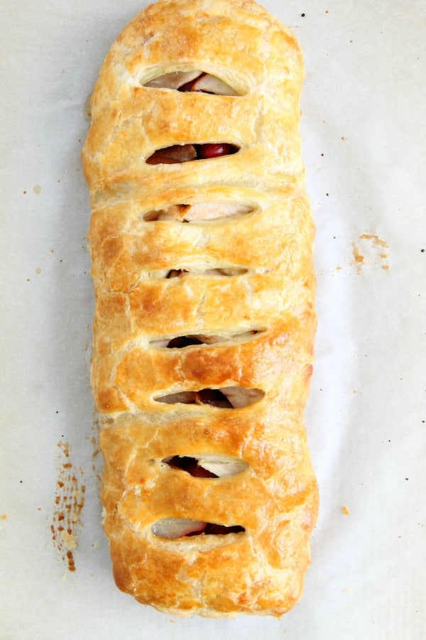 Cranberry Pear Strudel is a simple, sweet dessert! A few ingredients of seasonal fruit and puff pastry and you have the perfect treat! | The Bitter Side of Sweet #puffpastry #cranberry #pear Cranberry Pear Strudel on white background