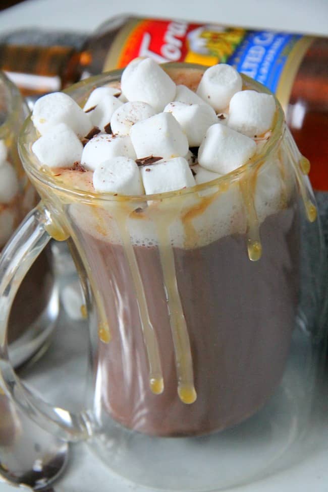 Salted Caramel Hot Chocolate Recipe is perfect for this time of year! Perfect combination of caramel, sea salt and chocolate! #christmassweetssweet #ad | The Bitter Side of Sweet Salted Caramel Hot Chocolate in glass