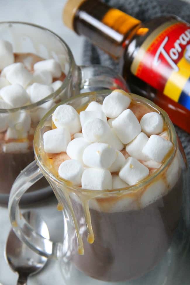 Salted Caramel Hot Chocolate Recipe is perfect for this time of year! Perfect combination of caramel, sea salt and chocolate! #christmassweetssweet #ad | The Bitter Side of Sweet Salted Caramel Hot Chocolate in glass