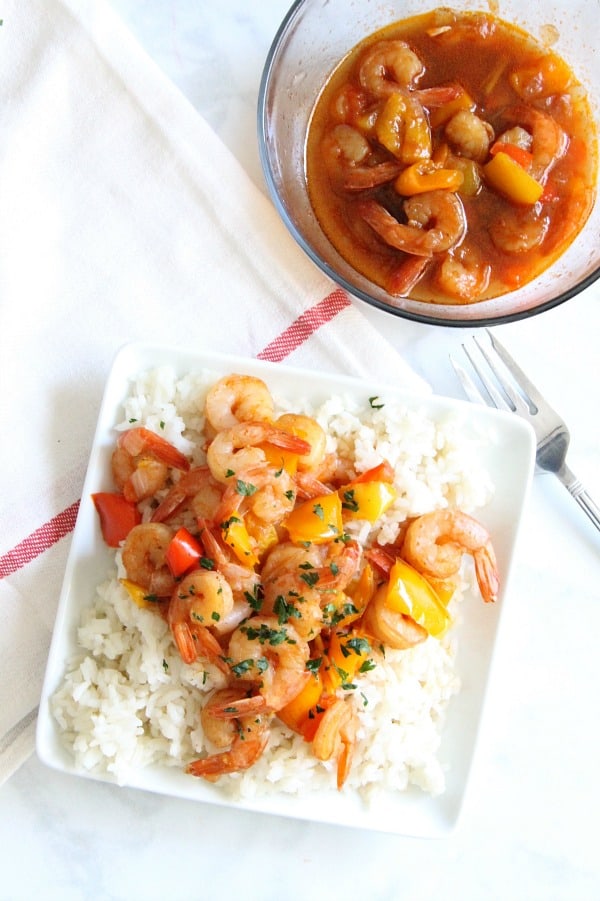 This Instant Pot Sweet and Sour Shrimp is one of the easiest dishes to make! Total cook time 8 minutes which makes this a perfect weeknight meal! Instant Pot Sweet and Sour Shrimp on white plate