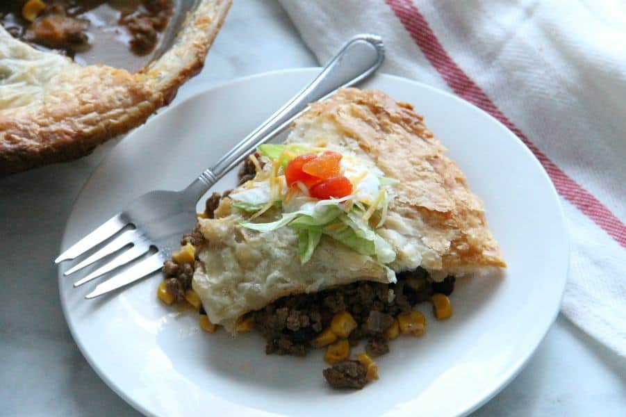 Puff Pastry Taco Pot Pie makes getting dinner on the table a total snap. Bonus points: it totally works for Taco Tuesday AND One Dish Wednesday. | The Bitter Side of Sweet #tacotuesday #easydinner #puffpastry Puff Pastry Taco Pot Pie on white plate