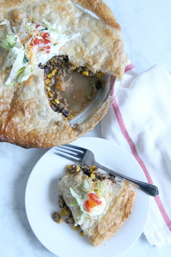Puff Pastry Taco Pot Pie makes getting dinner on the table a total snap. Bonus points: it totally works for Taco Tuesday AND One Dish Wednesday. | The Bitter Side of Sweet #tacotuesday #easydinner #puffpastry Puff Pastry Taco Pot Pie on white plate