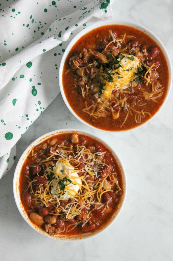 Instant Pot Three Bean Chili is so delicious and full of flavor! Twenty minutes of pressure cooking and you have this amazing bowl of comfort food! Instant Pot Three Bean Chili in white bowl