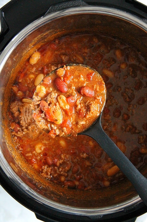 Instant Pot Three Bean Chili is so delicious and full of flavor! Twenty minutes of pressure cooking and you have this amazing bowl of comfort food! Instant Pot Three Bean Chili in pot