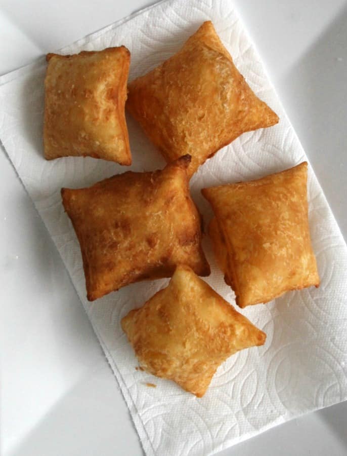 Puff Pastry Beignets are here for you when you're ready to let the good times roll. They don't have to just be for Fat Tuesday! Puff Pastry Beignets on white plate