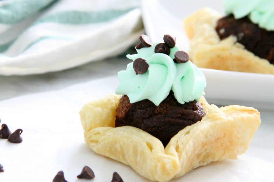 These Mint Chocolate Brownie Cups are a sweet addition to your next dinner party. Puff Pastry always adds a little bit of elegance to any dessert! Mint Chocolate Brownie Cups on white background