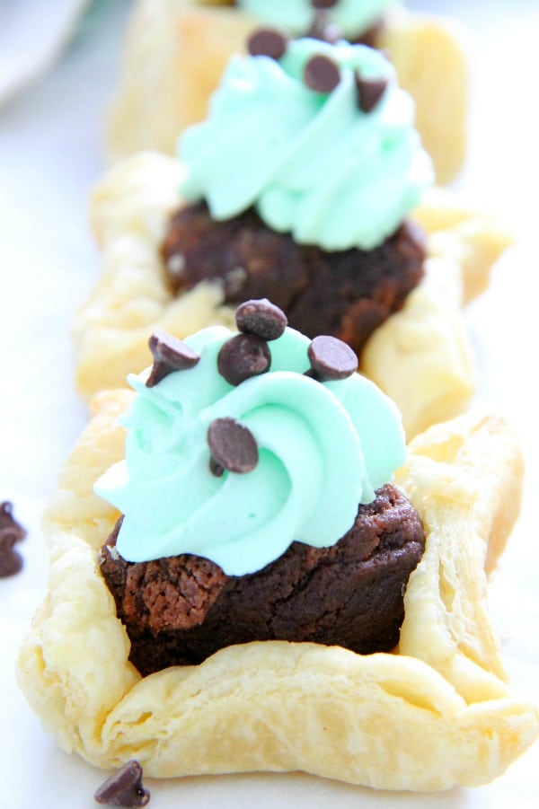 These Mint Chocolate Brownie Cups are a sweet addition to your next dinner party. Puff Pastry always adds a little bit of elegance to any dessert! Mint Chocolate Brownie Cups on white background