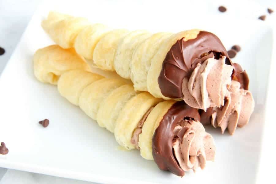 Chocolate Cream Horns are a sweet, delicate dessert for the chocolate lover in your life. You will love how easy they are! | The Bitter Side of Sweet Chocolate Cream Horns on white plate