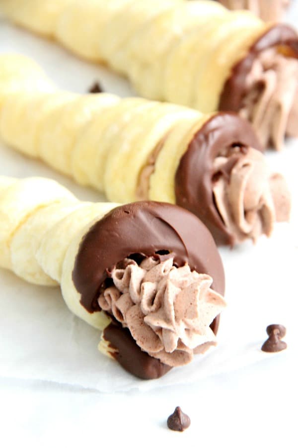 Chocolate Cream Horns are a sweet, delicate dessert for the chocolate lover in your life. You will love how easy they are! | The Bitter Side of Sweet Chocolate Cream Horns on white plate
