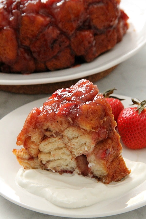 Soft, sticky Strawberry Monkey Bread is deliciously flavored with freshly cooked strawberries! Perfect for breakfast or a special treat! | The Bitter Side of Sweet Strawberry Monkey Bread one white plate