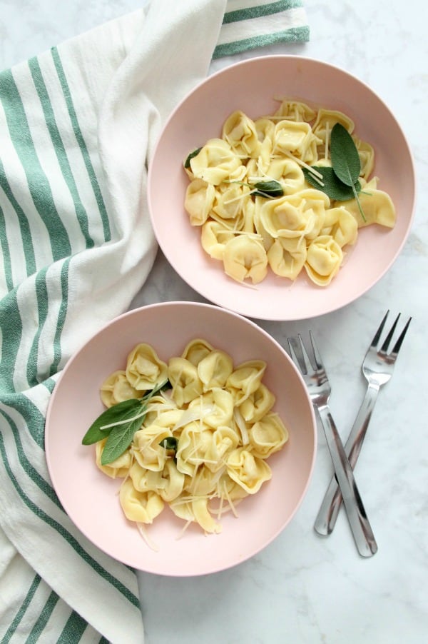 Tortellini with Butter and Sage is the easiest supper! Your family will love it! You can make it in minutes, but it's just so fancy. Tortellini with Butter and Sage in light pink bowl