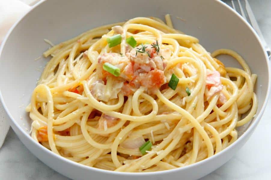 Bucatini with Tomatoes in grey bowl