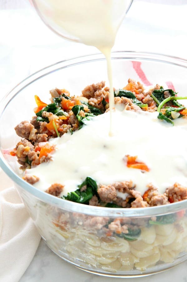 Creamy Sausage and Tomato Pasta couldn't be simpler with just a few ingredients. It's a fantastic Italian supper for any night of the week. Creamy Sausage and Tomato Pasta in bowl