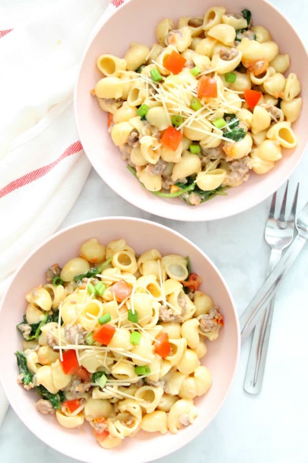 Creamy Sausage and Tomato Pasta couldn't be simpler with just a few ingredients. It's a fantastic Italian supper for any night of the week. Creamy Sausage and Tomato Pasta in bowl