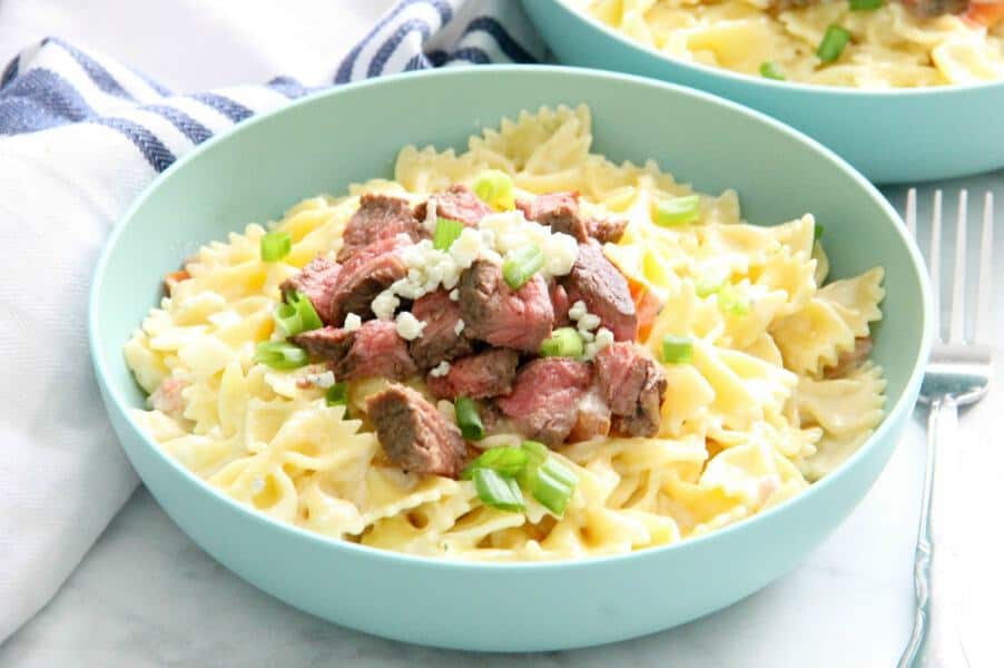 Steak Gorgonzola Pasta is boldly flavorful. This easy supper will be a new family favorite, we're sure of it. Perfect for any night of the week! | The Bitter Side of Sweet Steak Gorgonzola Pasta in blue bowl