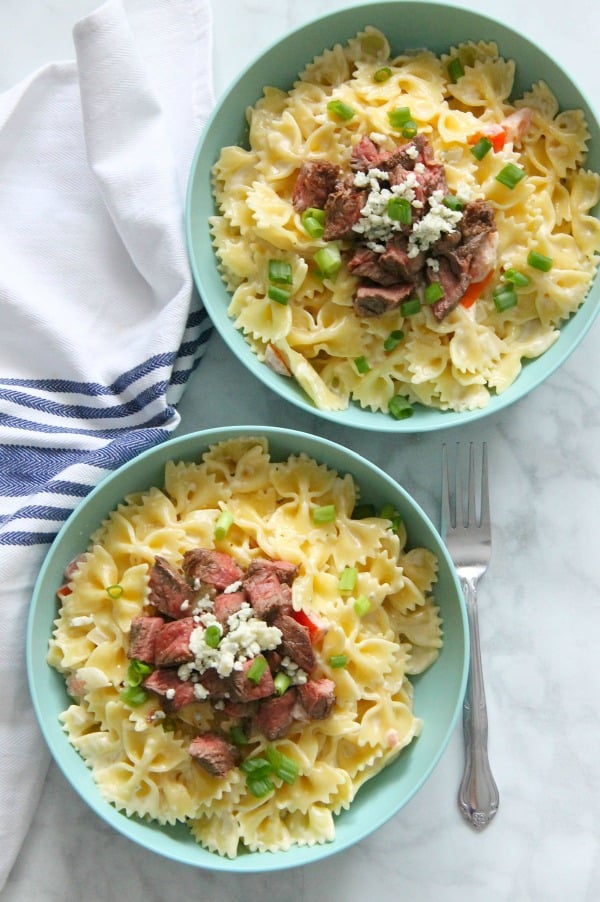 Steak Gorgonzola Pasta is boldly flavorful. This easy supper will be a new family favorite, we're sure of it. Perfect for any night of the week! | The Bitter Side of Sweet Steak Gorgonzola Pasta in blue bowl
