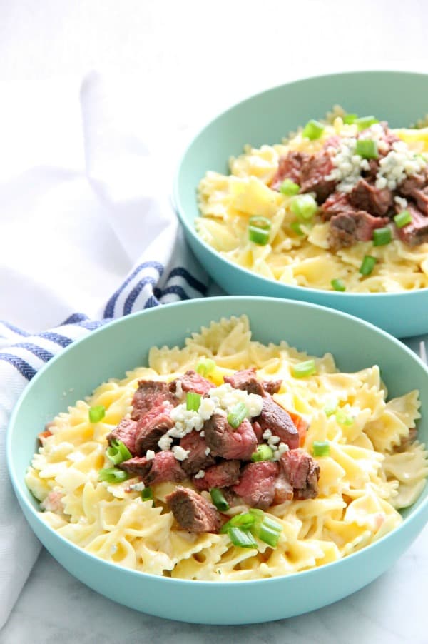 Steak Gorgonzola Pasta is boldly flavorful. This easy supper will be a new family favorite, we're sure of it. Perfect for any night of the week! | The Bitter Side of Sweet Steak Gorgonzola Pasta in blue bowl
