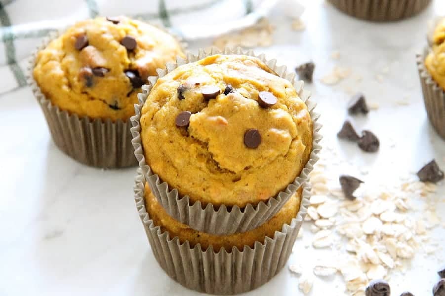Start your morning off with these Chocolate Chip Pumpkin Muffins! Perfect for a grab and go breakfast! They freeze well too! Chocolate Chip Pumpkin Muffins on white background