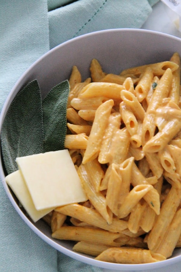 Creamy Pumpkin Pasta is perfect for a quick 30 minute meal! Made with pumpkin, sage and cream this pasta screams fall! You need this for your next dinner! Creamy Pumpkin Pasta in bowl