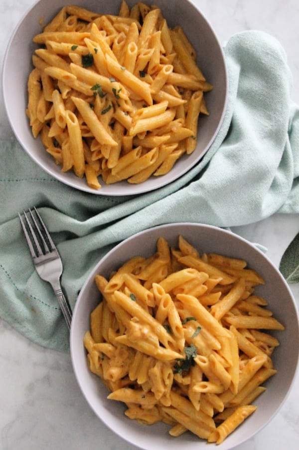 Creamy Pumpkin Pasta is perfect for a quick 30 minute meal! Made with pumpkin, sage and cream this pasta screams fall! You need this for your next dinner! Creamy Pumpkin Pasta in bowl